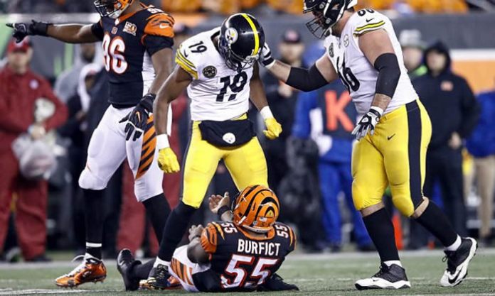 JuJu Smith-Schuster stands over Vontaze Burfict